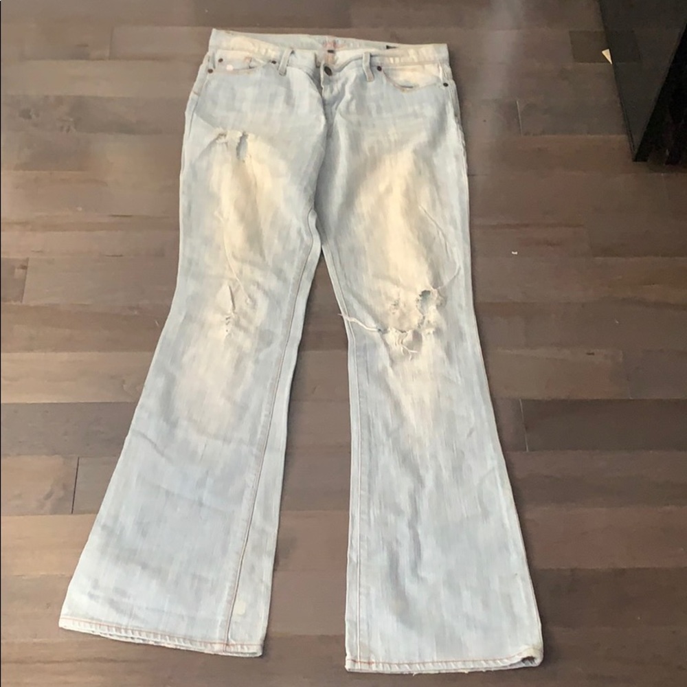 Sacred blue destroyed flare jeans